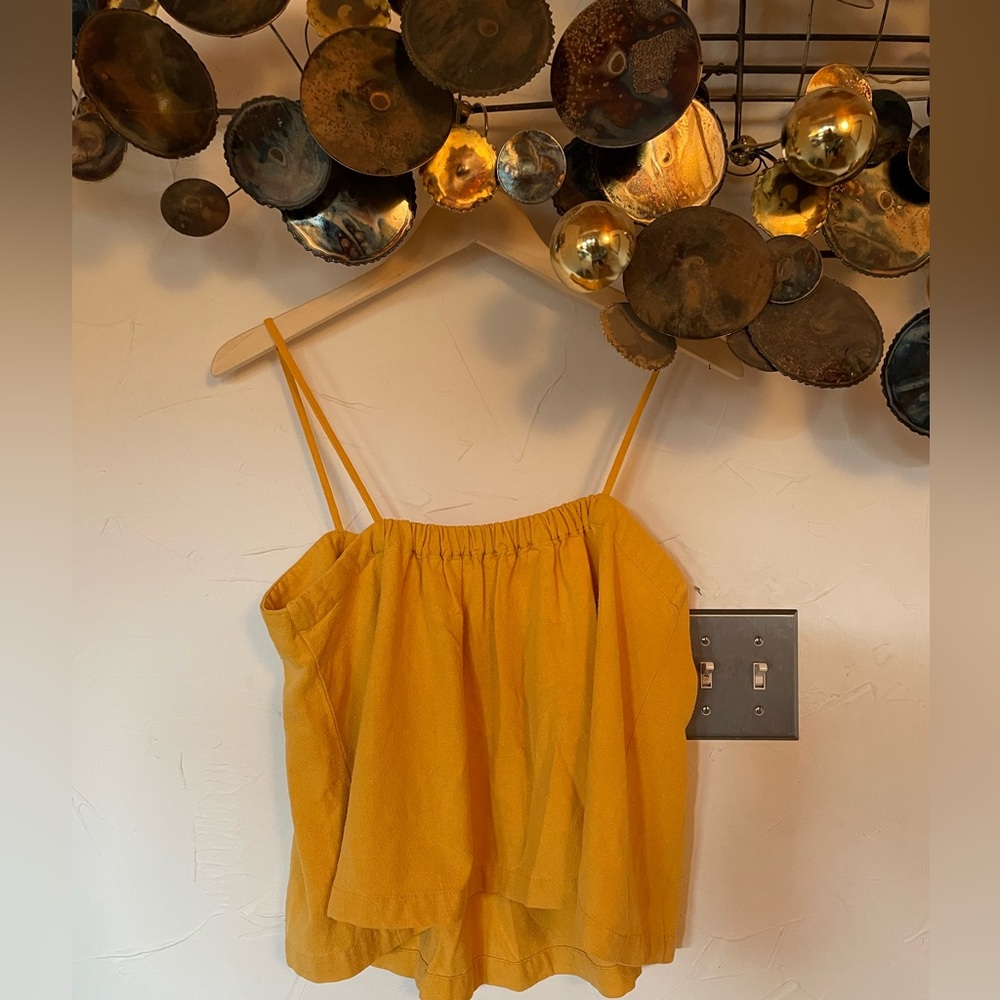 Yellow Levi’s 100% silk tank top.